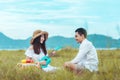 Picnic time. Young couple having fun with guitar on picnic in the park. Love and tenderness, dating, romance, lifestyle concept Royalty Free Stock Photo