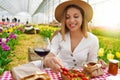 Picnic between tulips in spring time. Beautiful woman sitting between flowers enjoying organic local foods in Tuscany, Italy Royalty Free Stock Photo