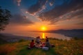 picnic with view of the sunset, people enjoying a moment of tranquility and beauty