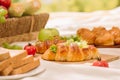 Picnic wicker basket with food, bread, fruit and orange juice on Royalty Free Stock Photo