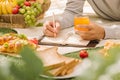 Picnic wicker basket with food, bread, fruit and orange juice on Royalty Free Stock Photo