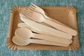 Picnic wooden cutlery and paper plates. Natural materials. Eco friendly