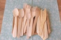 Picnic wooden cutlery and paper plates. Natural materials. Plastic free