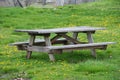 Picnic wooden table with benches in picnic and bbq family area in park Royalty Free Stock Photo