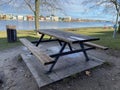 Picnic wooden table near lake Royalty Free Stock Photo