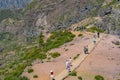 Pico do Areeiro mountain in Madeira Island with people walking on the PR1 trail towards Pico Ruivo. Royalty Free Stock Photo