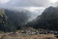 Pico do Arieiro hiking trail, amazing magic landscape with incredible views, rocks and mist, view of the valley between rocks Royalty Free Stock Photo