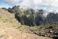 Pico do Arieiro hiking trail, amazing magic landscape with incredible views, rocks and mist, view of the valley between rocks