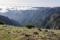 Pico Ruivo hiking, above clouds, amazing magic landscape, incredible views, sunny weather with low clouds, island Madeira, Portu