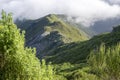 Pico Ruivo hiking, above clouds, amazing magic landscape, incredible views, sunny weather with low clouds, island Madeira, Portu