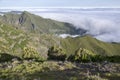 Pico Ruivo hiking, above clouds, amazing magic landscape, incredible views, sunny weather with low clouds, island Madeira, Portu