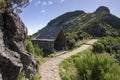 Pico Ruivo hiking, stone shelter, amazing magic landscape, incredible views, sunny weather with low clouds, island Madeira