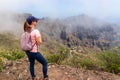 Pico Verde - Woman with backpack enjoying view on Teno mountain range near Masca village, Tenerife, Canary Islands, Spain, Royalty Free Stock Photo