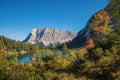 Pictorial lake seebensee in autumnal landscape with view to zugspitze mountain