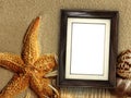 Picture frame on shells and sand background Royalty Free Stock Photo