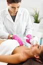 Adult woman having laser hair removal in professional beauty salon