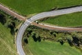 Picture of an aerial view with a drone of an unguarded railroad crossing in the Bavarian forest near Grafenau, Germany Royalty Free Stock Photo