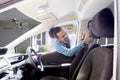 African man touching his new car seat Royalty Free Stock Photo