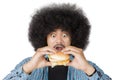 Afro man looks surprised with cheeseburger on studio