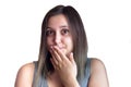 Picture of amazed brunette girl with hand over mouth isolated over white background