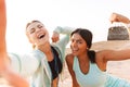 Amazing young sports woman showing biceps. Royalty Free Stock Photo