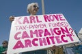 Picture of anti-Bush political rally in Tucson, AZ with signs about Karl Rove in Tucson, AZ