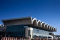 BUCHAREST, ROMANIA - MARCH 19, 2023: Main hall of arrivals terminal of Otopeni Airport during a sunny afternoon. Henri Coanda
