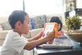 Boy playing online games on tablet