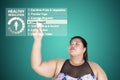 Asian fat woman touches a button of lose weight Royalty Free Stock Photo