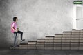 Asian schoolgirl walking toward a school door Royalty Free Stock Photo