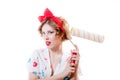 Picture of attractive blond pinup girl with green eyes & red lips holding bolster surprised & excited Royalty Free Stock Photo