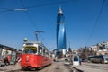 Tram ready for departure on the train station stop, the Avaz Twist Tower is seen in the background.