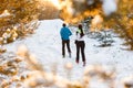 Picture from back of running two athletes in winter park Royalty Free Stock Photo