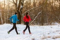 Picture from back of sports man and woman on morning run in winter