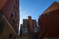 Backyard of some old, poor and dilapidated red brick buildings, of the vintage North American architectural style, in Montreal