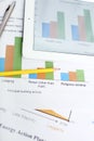 Picture of bar graph on paper and tablet. Portrait of pen and pencil on the paper Royalty Free Stock Photo