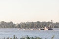 Cargo ship, a barge, cruising on the Danube river in Serbia, in belgrade, carrying construction material, coal, sand and gravel. Royalty Free Stock Photo