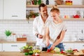 Picture of beautiful couple in love preparing breakfast in kitchen Royalty Free Stock Photo