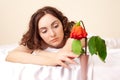 Picture of beautiful sad woman with a wither rose
