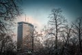 BELGRADE, SERBIA - JANUARY 20, 2022: Selective blur Beogradjanka tower by of trees covered in snow in winter called Palata Beograd