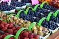 Picture of berries in small baskets for sale on a fresh morning market. Royalty Free Stock Photo