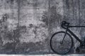 Picture of a bicycle in front of big concrete wall Royalty Free Stock Photo