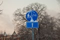 Selective blur on a european blue roadsign indicating the presence of a shared bicycle lane and pedestrian path that is mandatory
