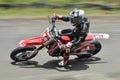 Picture of Bike rider that wearing colorful outfit and riding red bike