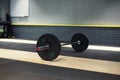 Black bar on the platform in the crossfit zone Royalty Free Stock Photo