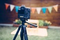 Picture of digital camera placed on tripod Royalty Free Stock Photo