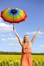 Picture of blond pretty female holding rainbow Royalty Free Stock Photo