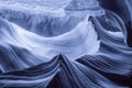 Blue cast color on the wavy rocks in a canyon