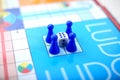 Picture of blue ludo tokens with dice