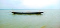 Picture of a boat without a boatman in the middle of the river Padma. Royalty Free Stock Photo